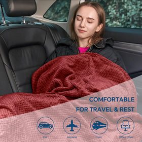 BEDELITE travel blanket stored in the included bag for tidy packing.