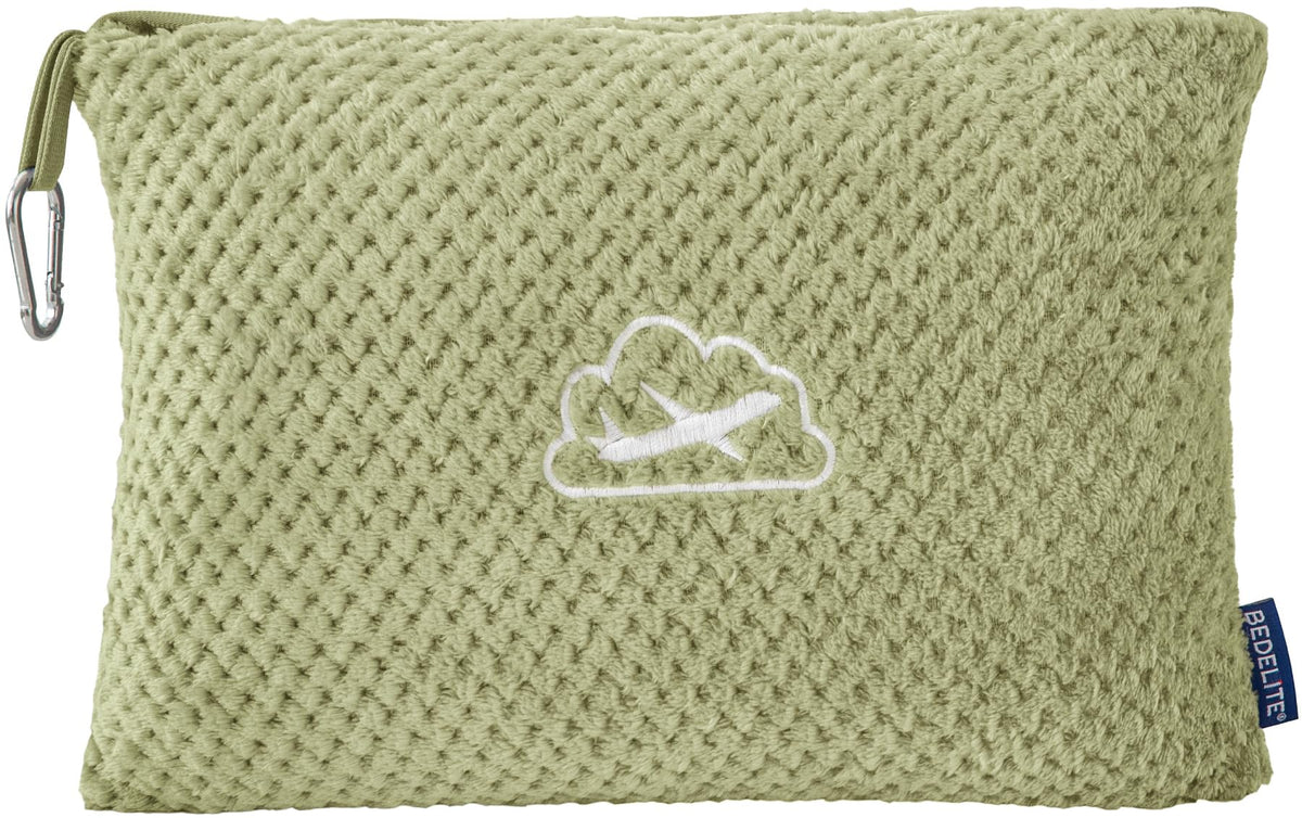 BEDELITE travel blanket with luggage sleeve attached to a suitcase for easy transport.