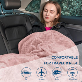 BEDELITE travel blanket on airplane seat illustrating comfort during flights.