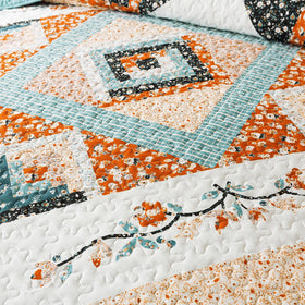 Bedifany floral quilt stitching detail adds elegant bedroom style.