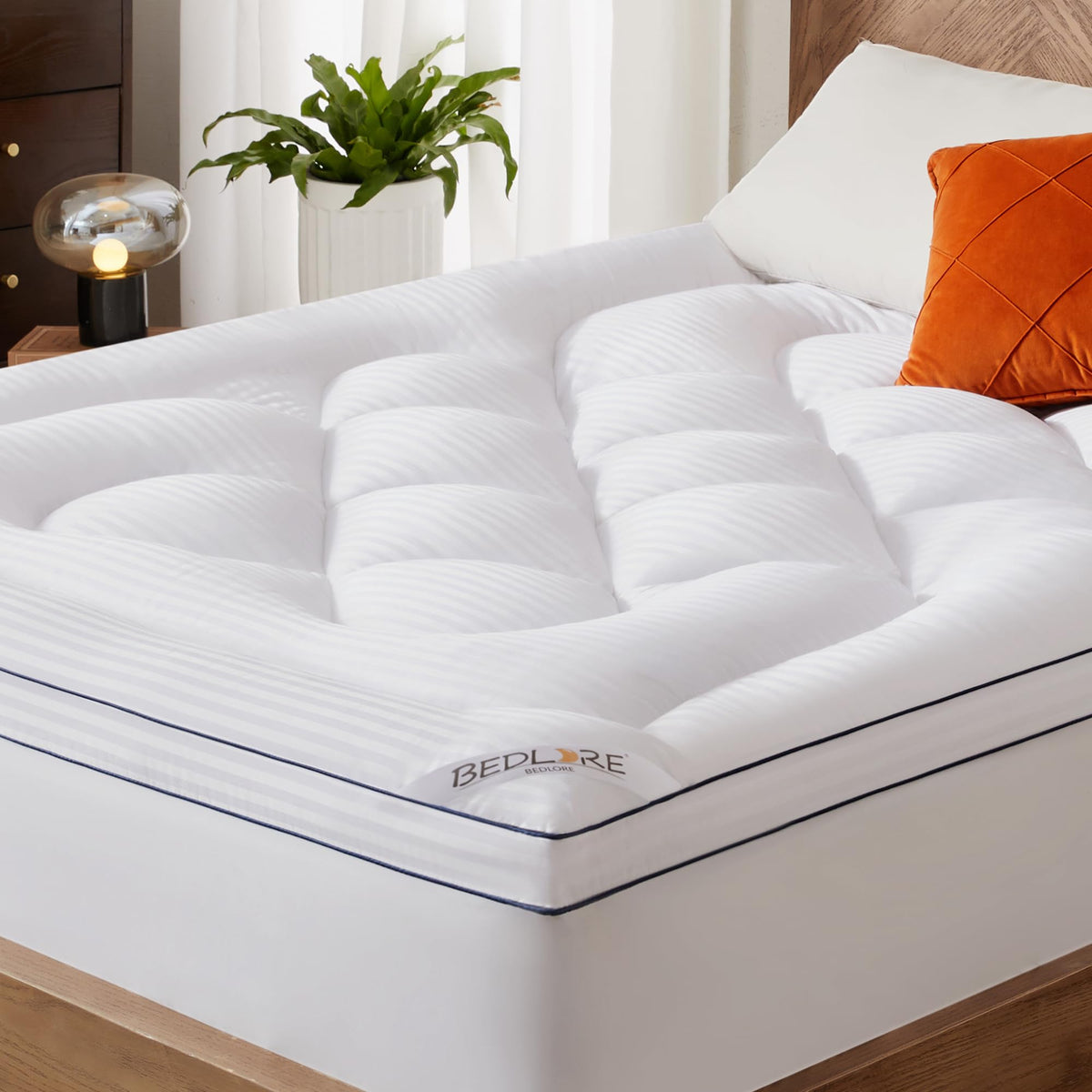 BEDLORE King Mattress Topper packaging opened, expected full loft for improved comfort.