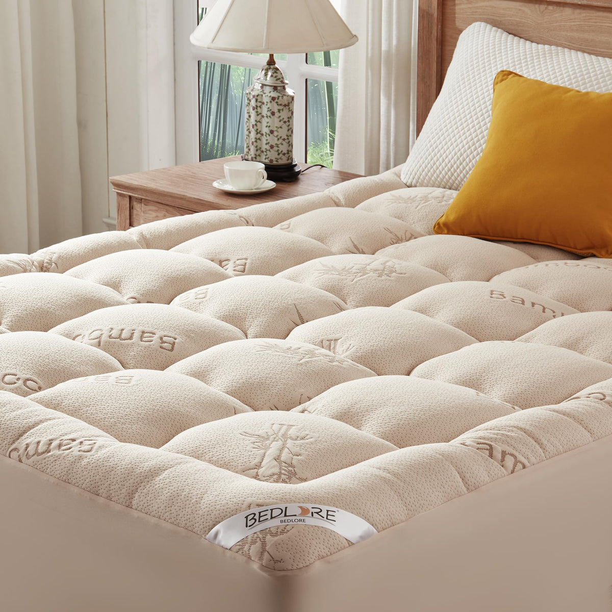Bedlore King topper with soft pillow-top enhances comfort on a king bed.
