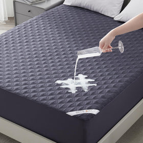 Bedlore waterproof mattress protector with 18-inch depth shields king beds from spills.