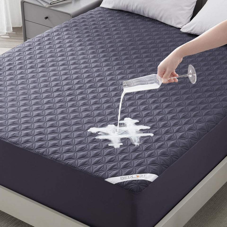 Bedlore waterproof mattress protector navy blue close-up showing spill protection and premium material