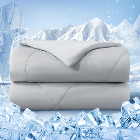Bedsmile cooling comforter on a bed with reversible sides for cooler sleep