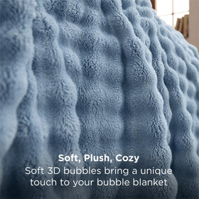 Bedsure GentleSoft blue throw on a bed adds texture and all-season comfort.