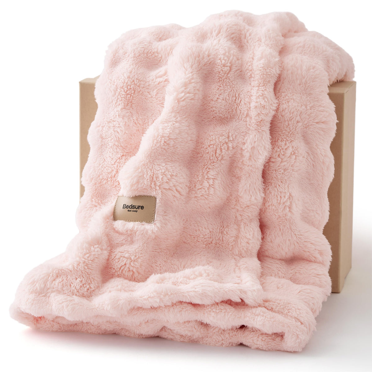 Bedsure 3D Fleece Bubble Blanket on pink couch enhances cozy living room style