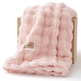 Bedsure 3D Fleece Bubble Blanket on pink couch enhances cozy living room style