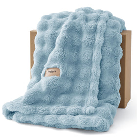 Bedsure 3D Fleece Bubble Blanket on couch, showcasing plush texture and cozy warmth.