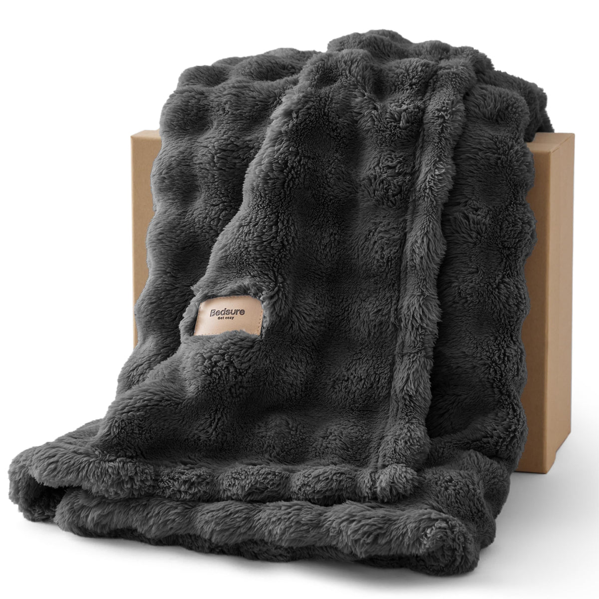 Bedsure 3D fleece bubble blanket on a sofa adds cozy texture for lounging.