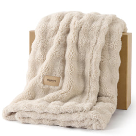 Bedsure 3D fleece bubble blanket on a couch adds cozy texture for lounging.