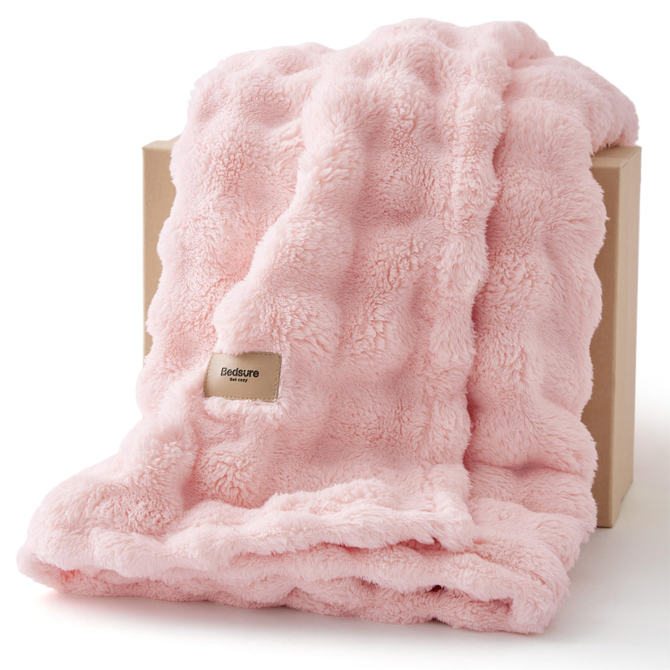 Bedsure 3D Fleece Bubble Blanket on a couch adds soft texture for lounging