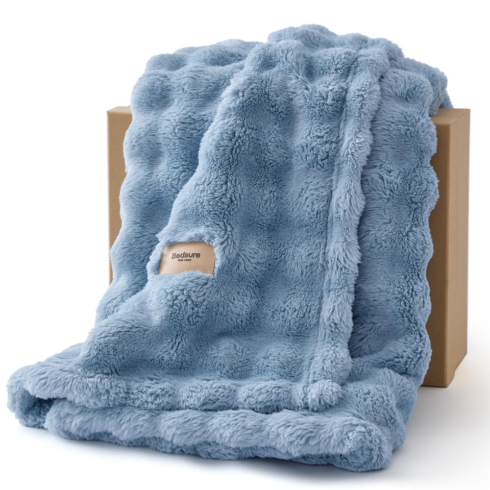 Bedsure 3D Fleece Bubble Blanket draped on couch adds cozy texture.