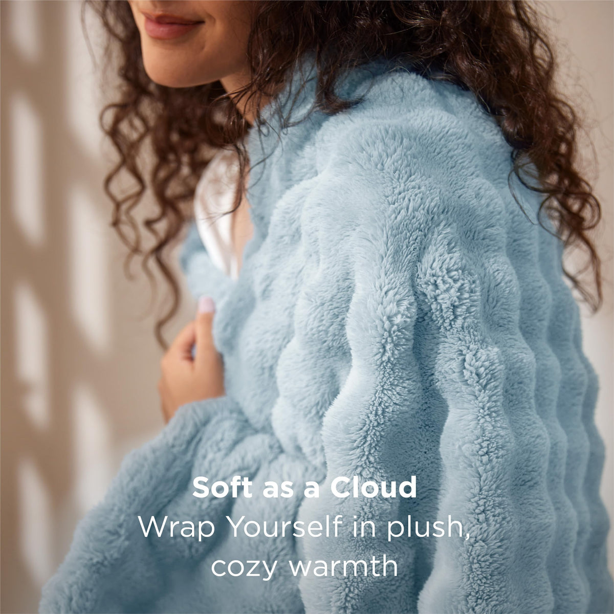 Bedsure light-blue throw folded neatly for easy styling and decor.