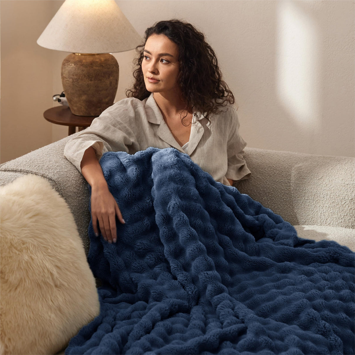 Bedsure 3D fleece bubble blanket draped over chair for decorative warmth