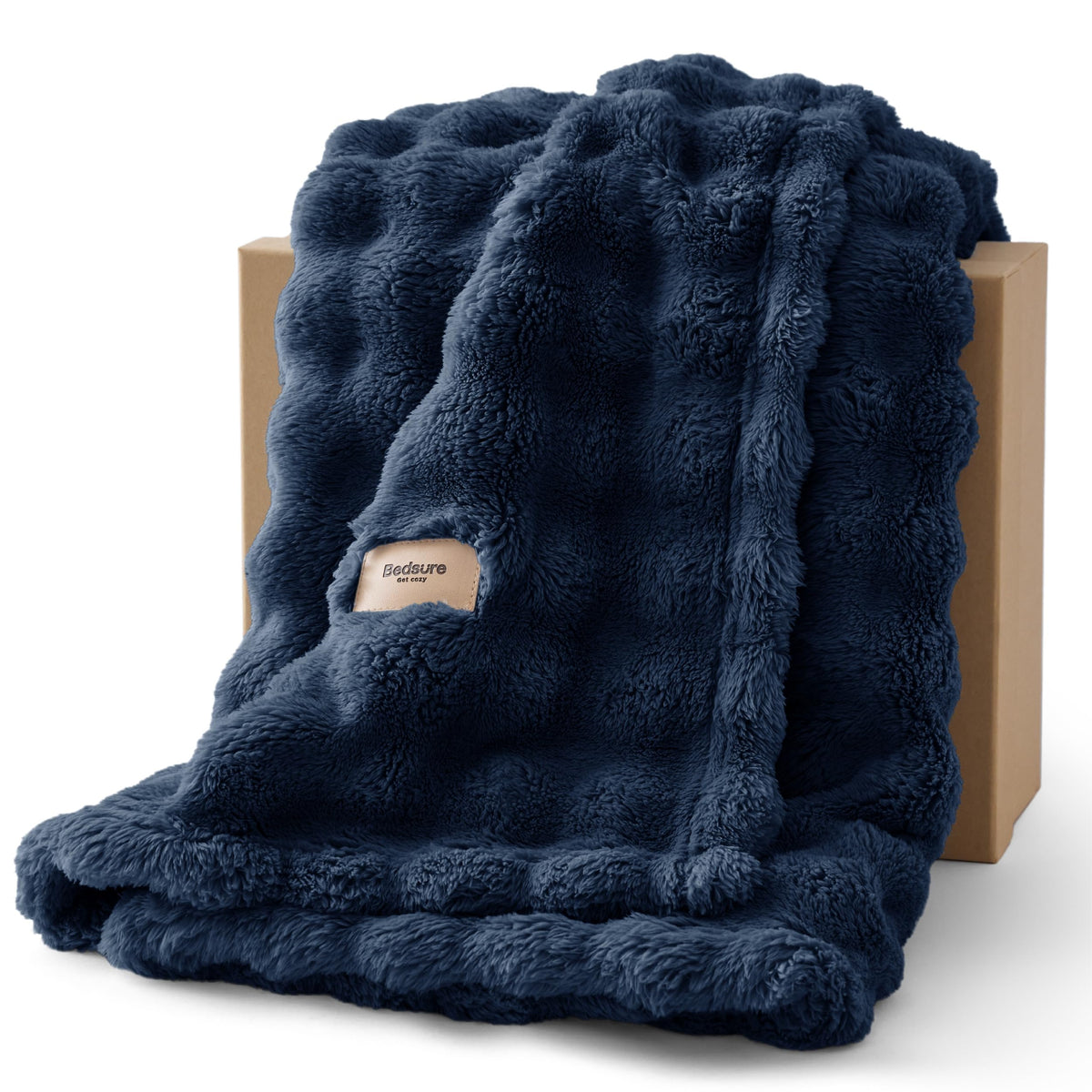 Bedsure 3D fleece bubble blanket in navy shows cozy texture for living room relaxation.