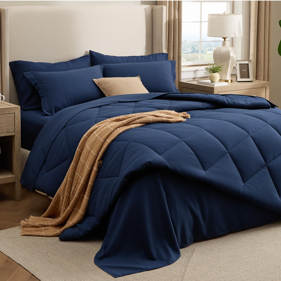Bedsure 7-piece queen comforter set in navy with diamond quilting for a hotel-like look.