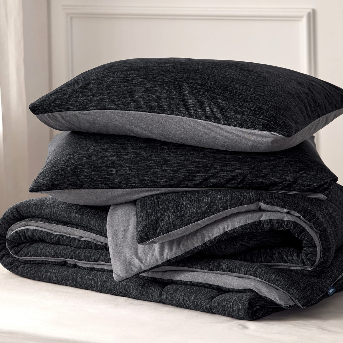 Bedsure charcoal black bedding setup for a modern coordinated bedroom.