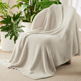 Bedsure beige knit throw on bed adds lightweight, cozy comfort.