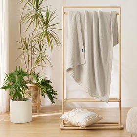 Bedsure beige knit throw blanket folded neatly for quick storage.