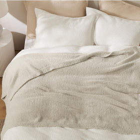 Bedsure beige knit throw blanket for picnics adds soft coverage.