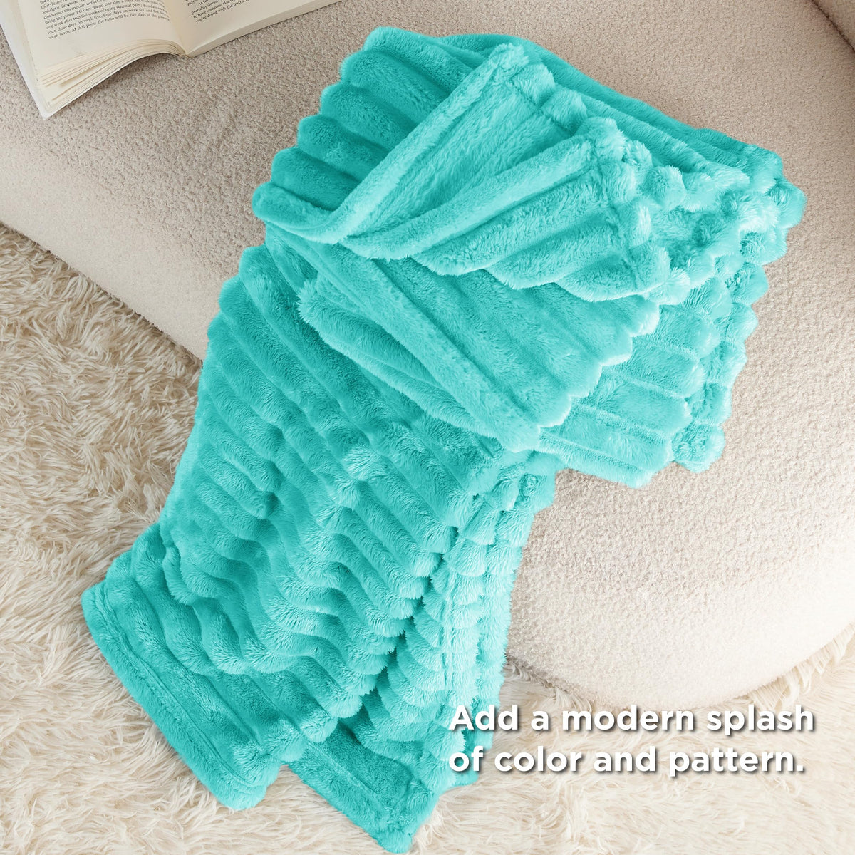 Bedsure Blue Fog fleece blanket draped over a bed for decor