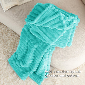 Bedsure Blue Fog fleece blanket draped over a bed for decor