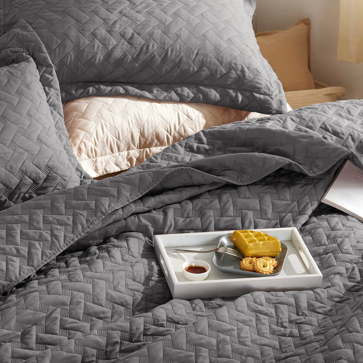 Bedsure bedroom ambience with grey quilt invites cozy, tidy décor.