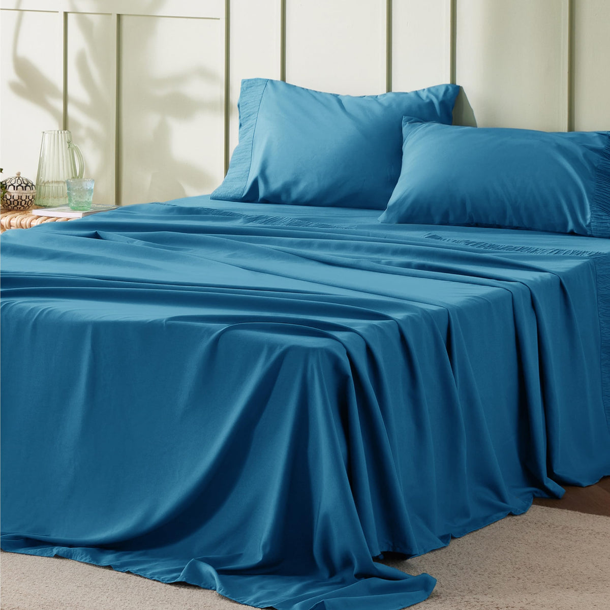 Bedsure California King sheet set on teal bed showing four-piece package for premium sleep