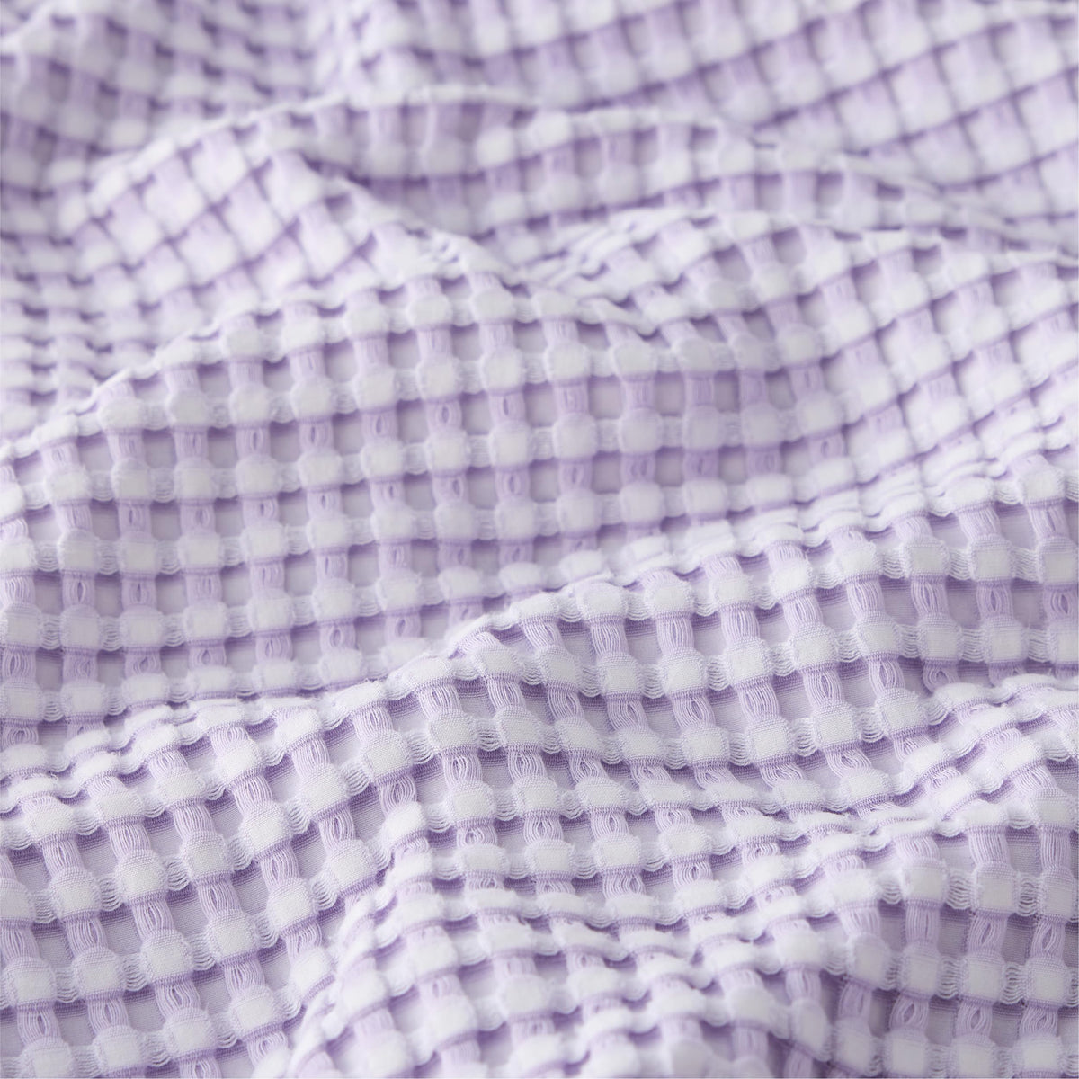 Bedsure light-purple queen blanket on bed adds soft, relaxing color.