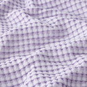 Bedsure light-purple queen blanket on bed adds soft, relaxing color.