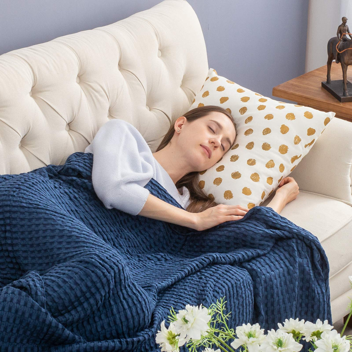 Bedsure blanket draped on bed in navy for breathable comfort.