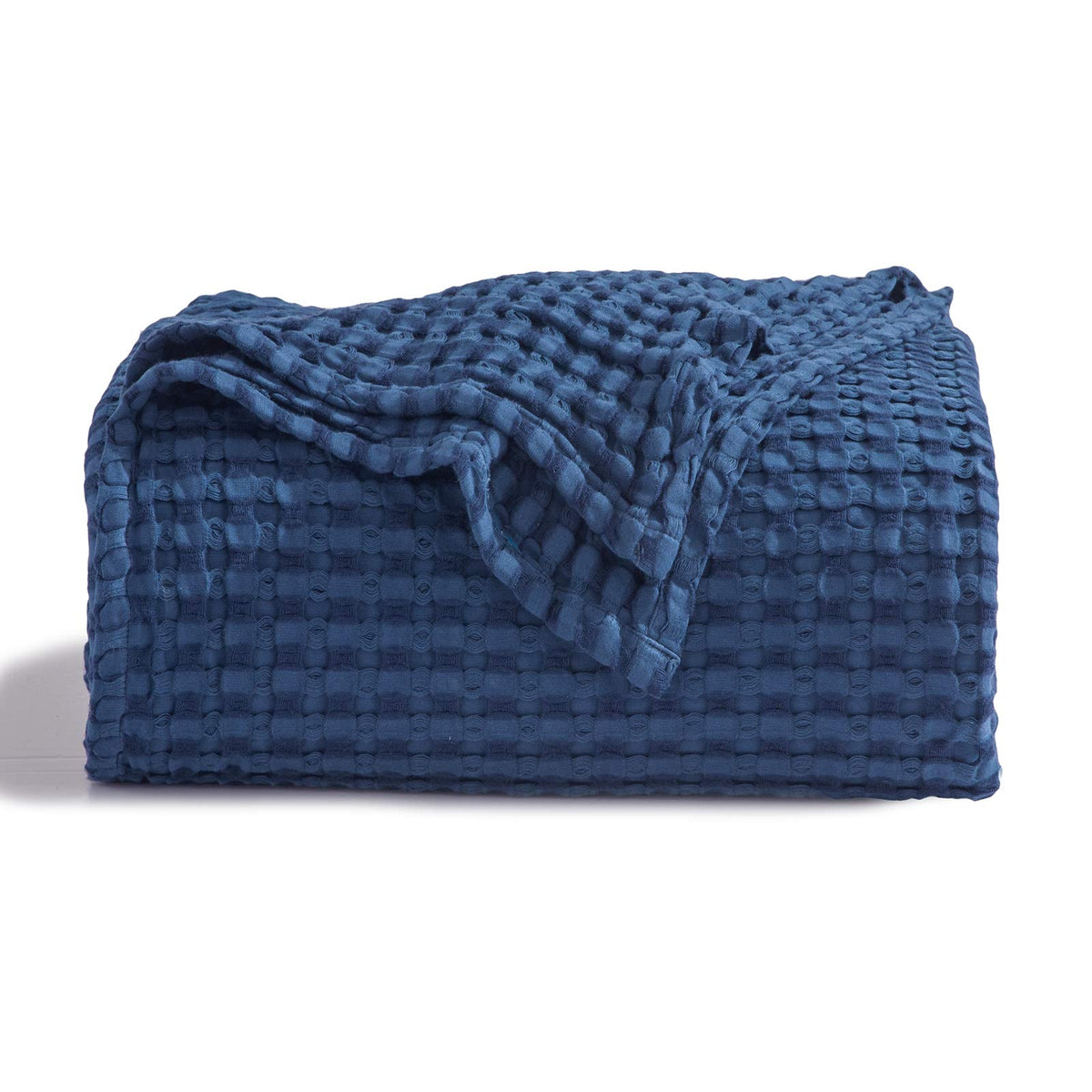 Bedsure cooling cotton waffle blanket folded in navy, soft and lightweight.