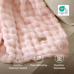 Bedsure couch and bed decor blanket adds texture and a soft pink focal point.