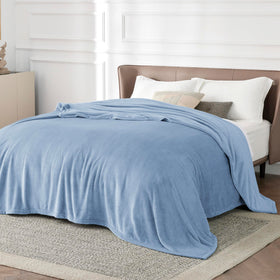 Bedsure cozy lounge blanket draped over a couch for relaxed movie nights.