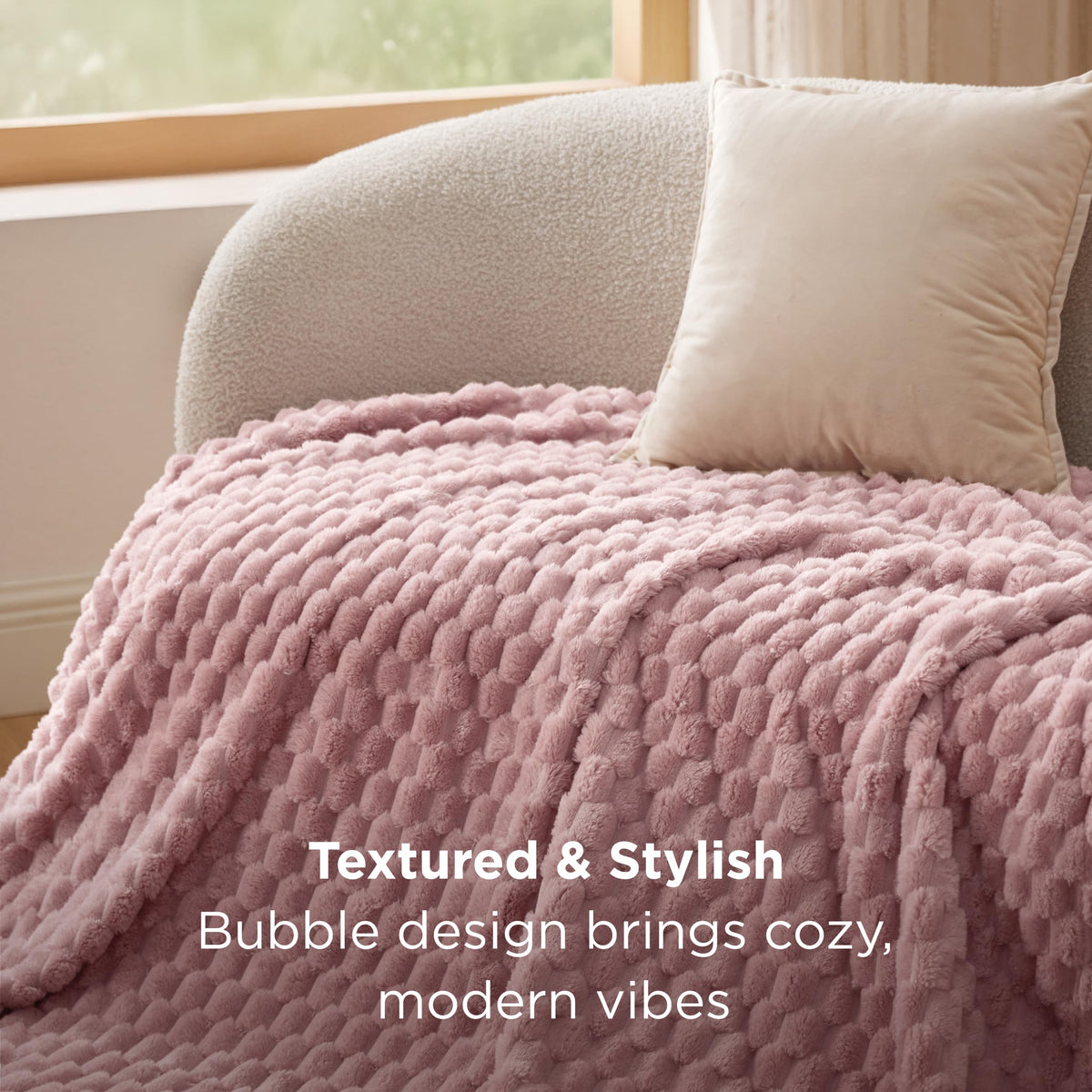 Bedsure Dusty Rose Throw Blanket draped on couch as decor