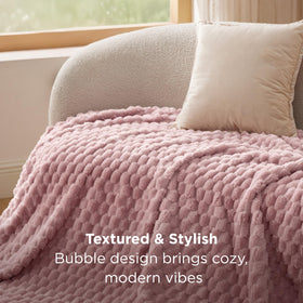 Bedsure Dusty Rose Throw Blanket draped on couch as decor