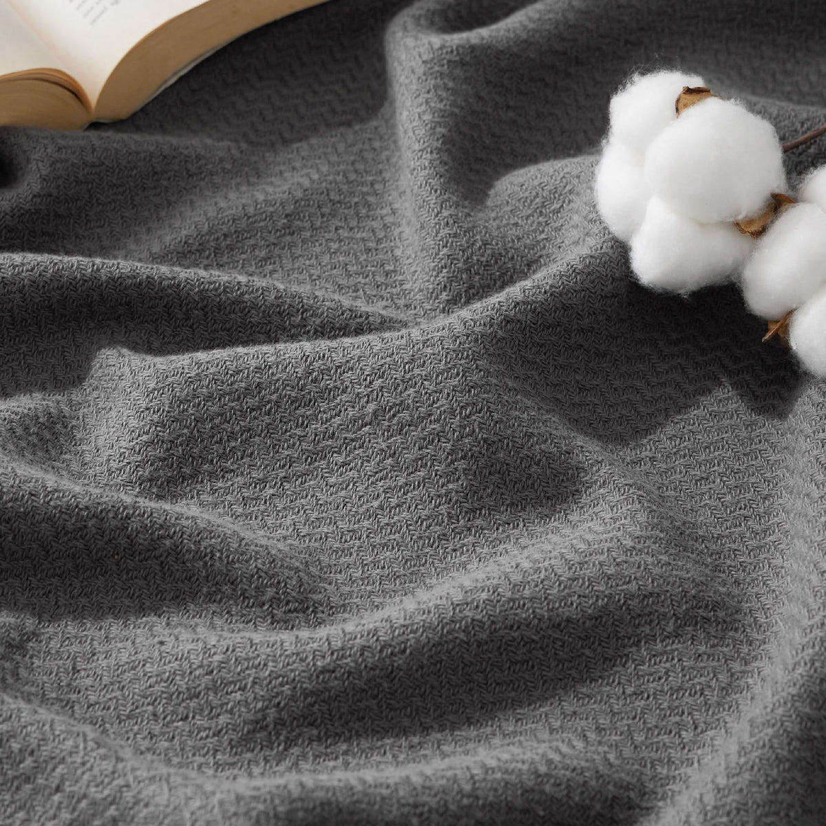 Bedsure GentleSoft 100% cotton blanket close-up highlights the fine herringbone texture for everyday elegance.
