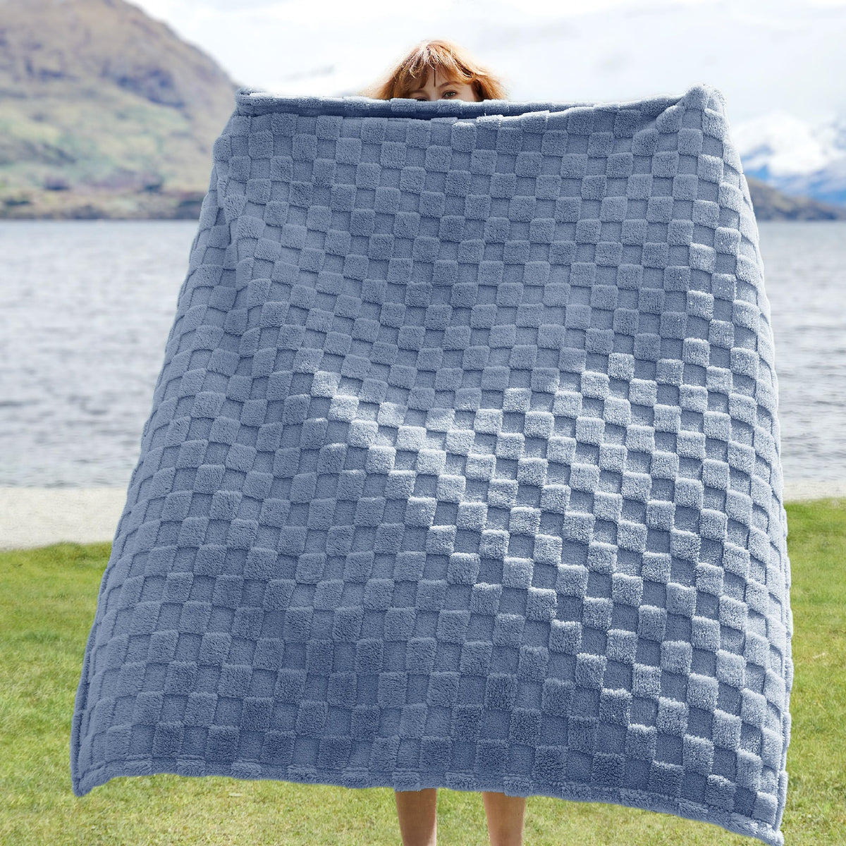 Bedsure GentleSoft Ashley Blue Throw folded on sofa, ideal for quick warmth during movie nights.