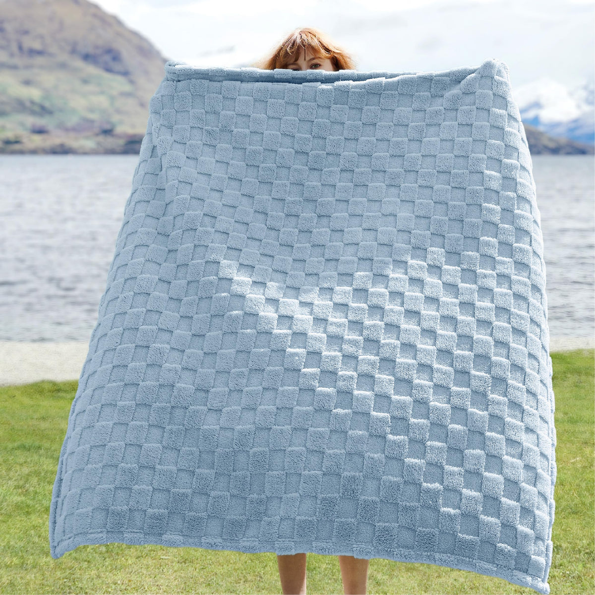Bedsure GentleSoft baby blue throw checker pattern adds modern charm to living room decor.