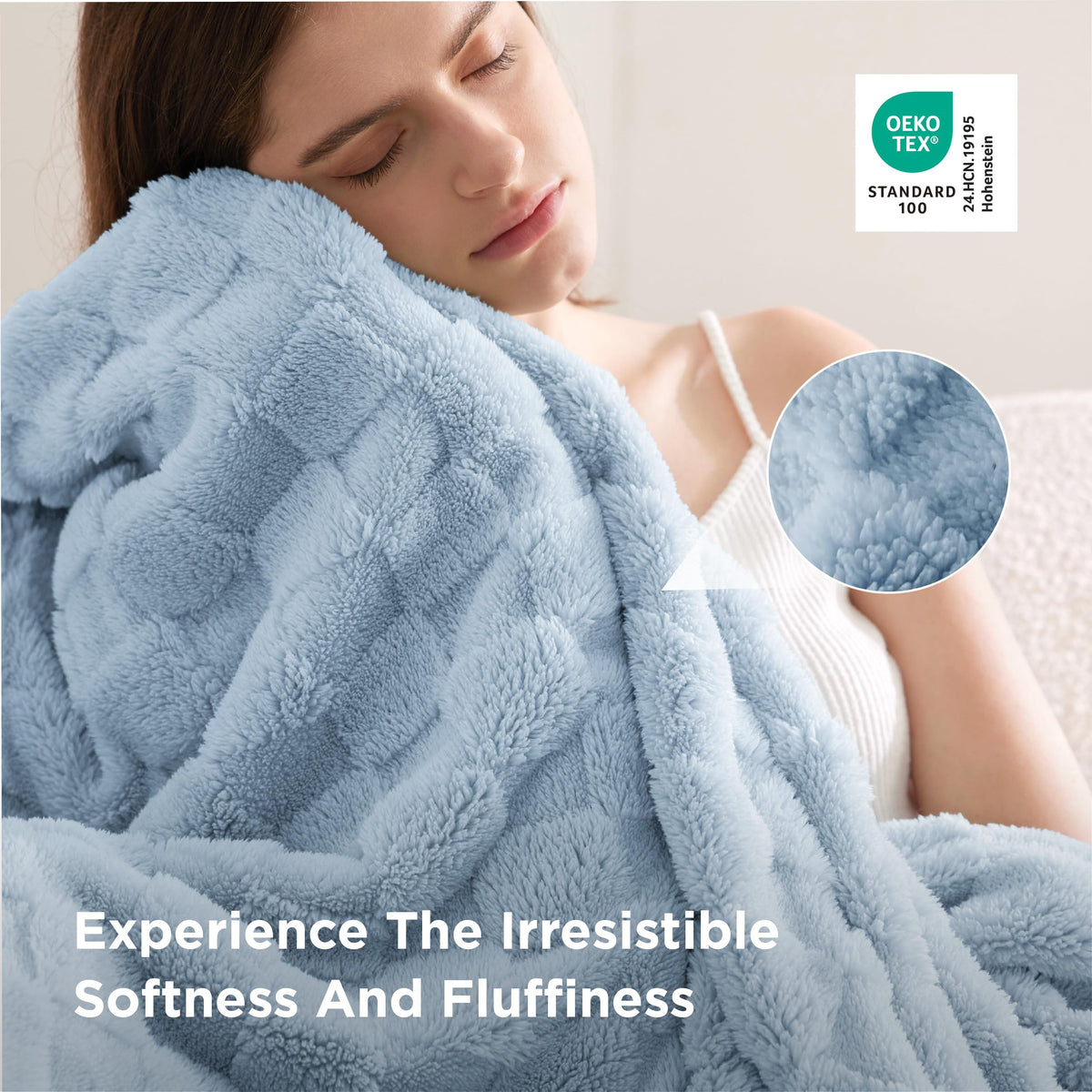 Bedsure GentleSoft baby blue throw folded on sofa invites lounging and relaxation.