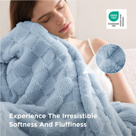 Bedsure GentleSoft baby blue throw folded on sofa invites lounging and relaxation.