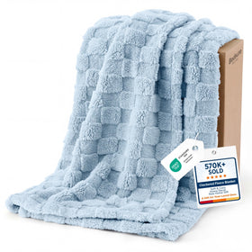 Bedsure GentleSoft baby blue throw texture closeup showcases plush warmth for cozy evenings.