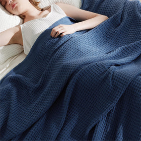 Bedroom scene with Bedsure Gentlesoft navy blanket on bed