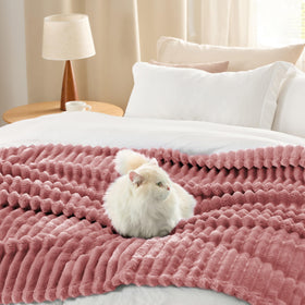 Bedsure GentleSoft blanket draped for bedtime snuggle and versatile warmth.