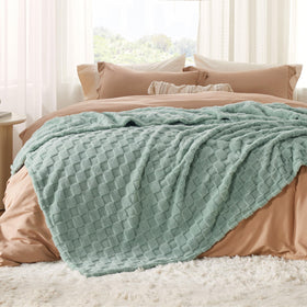 Bedsure Gentlesoft blanket on couch for relaxing warmth.