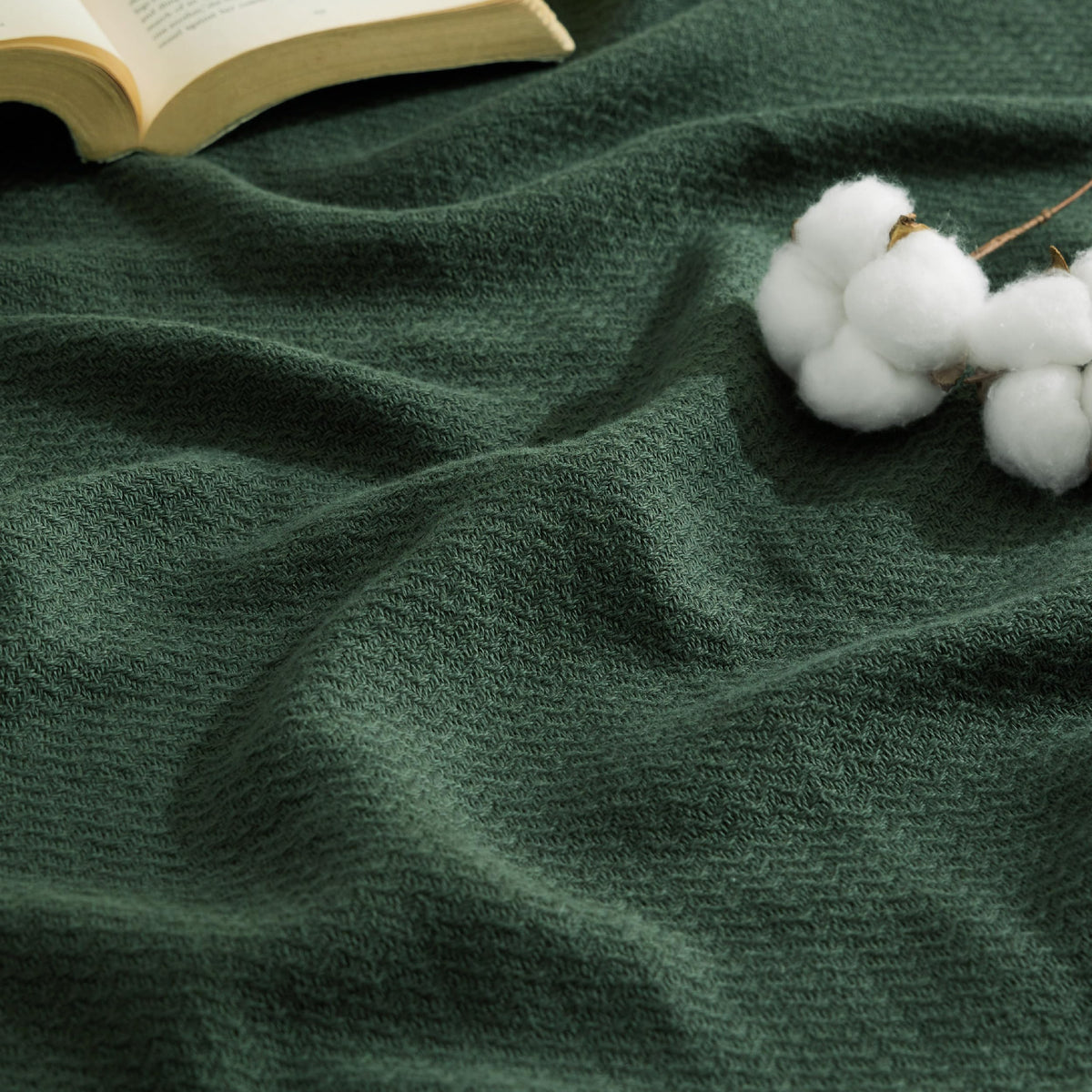Bedsure GentleSoft blanket with dark green herringbone weave, breathable for summer evenings.