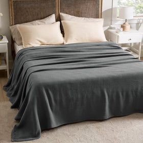 Bedsure GentleSoft lifestyle shot features cozy warmth on sofa for evenings.
