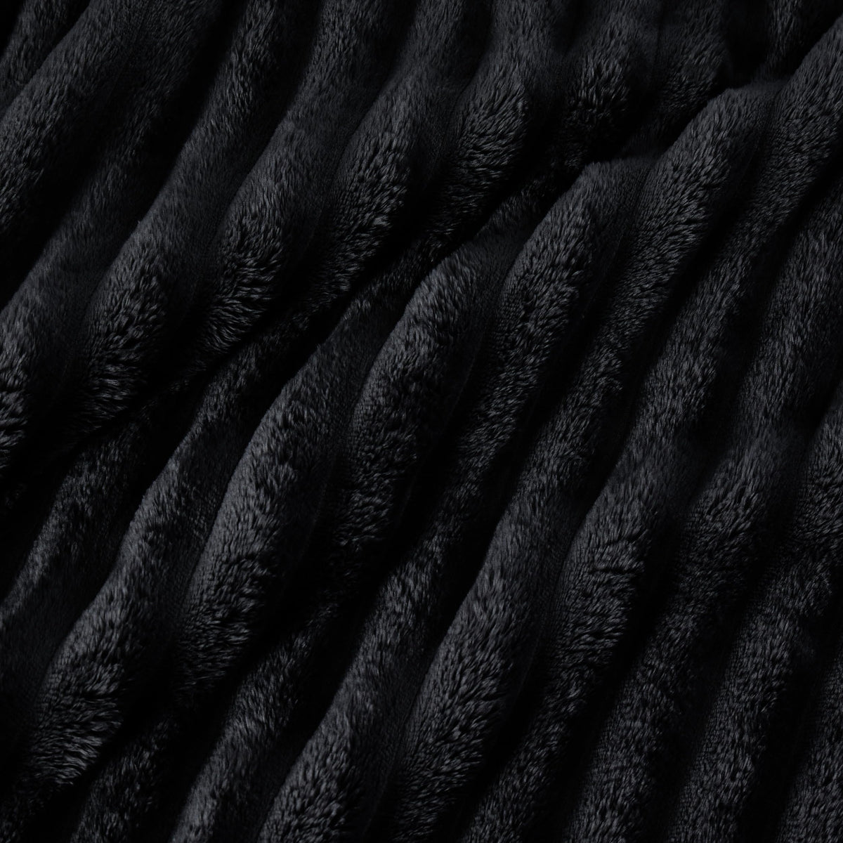 Bedsure GentleSoft blanket layered with throws for a chic lounging setup