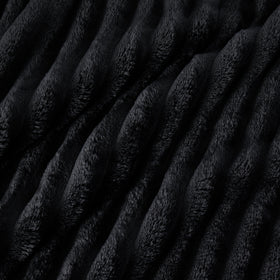 Bedsure GentleSoft blanket layered with throws for a chic lounging setup